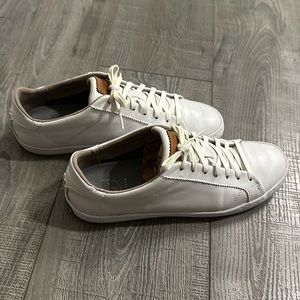 White leather sneakers by Cole Haan, in good used condition. No rips/tears.